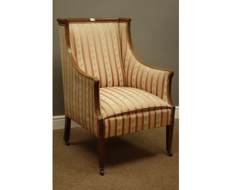Edwardian mahogany framed upholstered drawing room armchair, cross banded down swept arms with inverted supports, square tape