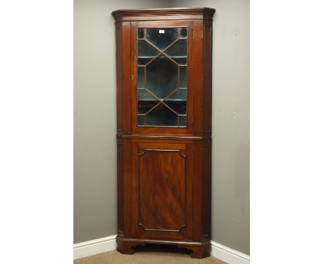 19th century mahogany floor standing corner cupboard, glazed upper and panelled lower doors, on shape bracket feet, H197cm, W