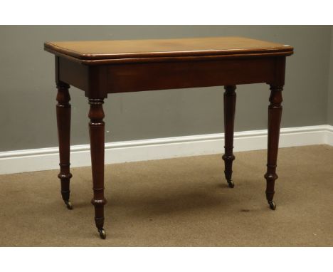 Victorian mahogany card table, moulded rectangular top with rounded corners, baize lined playing surface, on turned supports 