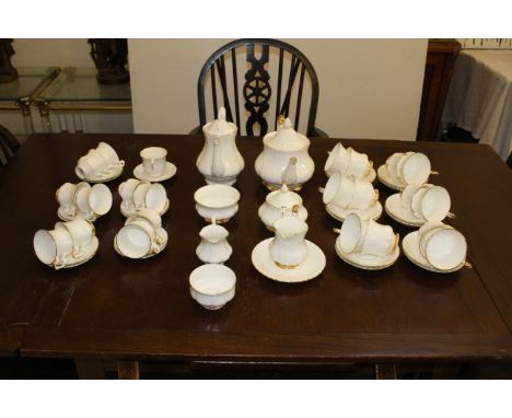 A Royal Albert Val D'or part tea service, comprises teapot and cover, covered sugar basin, sugar bowl, milk jug, twelve tea c