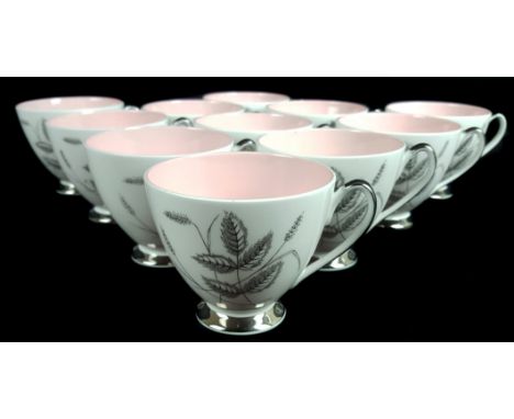 A vintage Queen Anne Harvest Pink pattern tea service, silver lustred handles and feet, 1960's, comprises eleven cups, eleven