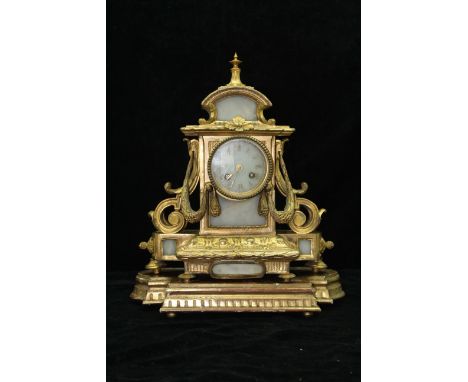 A white marble and ormolu clock garniture, comprising a clock and a pair of five light candelabra, the rectangular clock case