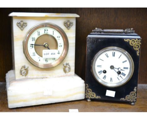 A white marble clock with a black wooden mantle clock