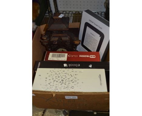 A box containing a Kindle, a Nook and a mantle clock