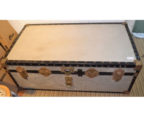 A metal bound steamer trunk