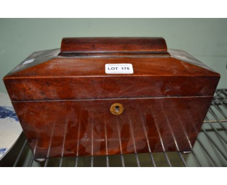 A Victorian mahogany sarcophagus tea caddy with interesting contents