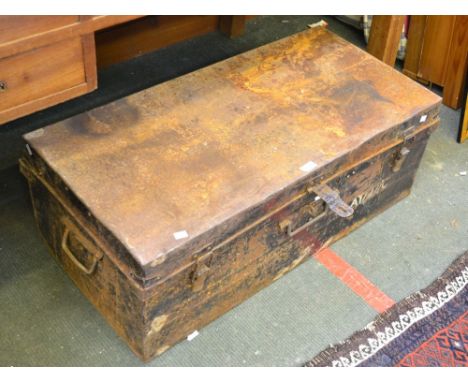 A large metal tin trunk