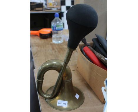 A vintage brass bulb form car horn