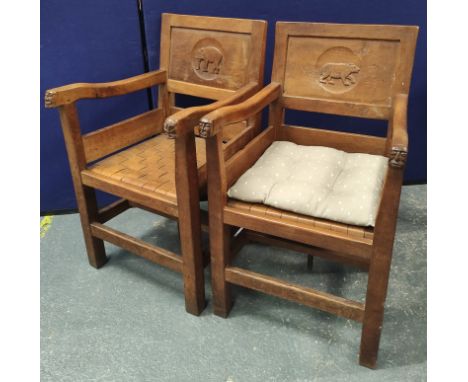 Robert "Mouseman" Thompson two pairs oak dining chairs including two carver armchairs, each with masks to their handle termin