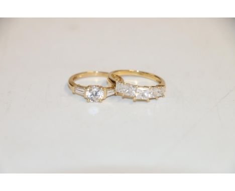 14k gold ring with 5 stones, size O, and another 14k ring size O, 5.6g gross 