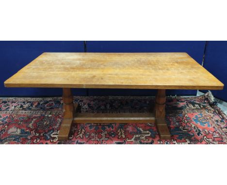 Robert "Mouseman" Thompson oak refectory dining table, the rectangular top above two turned and faceted columns with horizont