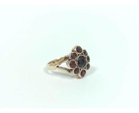 9ct gold garnet cluster ring 5.8g, Size 'J'.