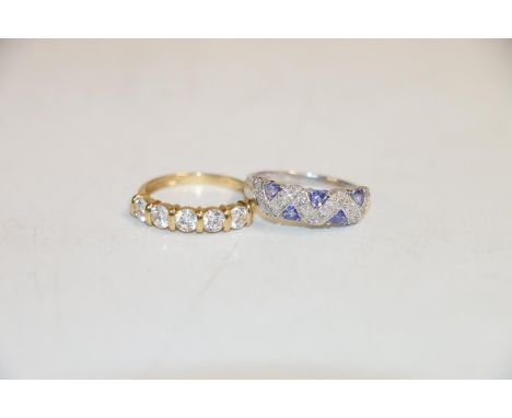 14k gold ring with 5 clear stones, size P, and another 9k ring with interlaced chip diamonds and blue/purple stones, size P, 