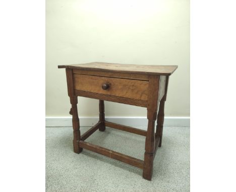 Robert "Mouseman" Thompson oak side table, the rectangular top above frieze drawer on faceted turned column supports with und