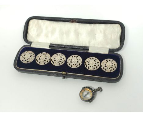 Set of six silver pierced buttons by Liberty 1900, cased, and a silver compass.Condition:Buttons and case in lovely condition