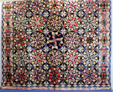 Exceptionally fine and large antique pieced mosaic patchwork quilt, probably American, worked in polychrome silks, taffetas, 