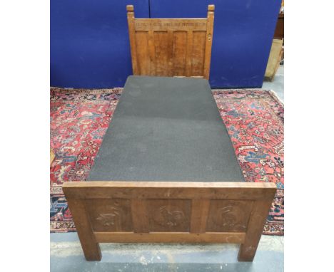 Robert "Mouseman" Thompson oak single bed, the four panel headboard inscribed "In malice be ye babes but in mind be men", wit