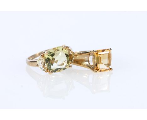 9k gold ring with cushion cut stone flanked by two further stones, size O, and 9K gold ring with rectangle cut stone size Q, 