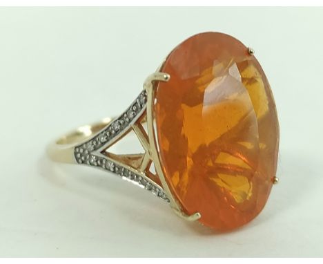 Fire opal ring, 19mm x 15mm, with diamond set shoulders, in 9ct gold, size 'N'.