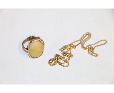 9k gold ring with cabochon, size N, 5g, and a 9k St Christopher pendant on 14K chain, 3.2g gross. 