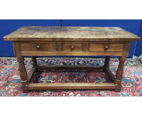 Robert "Mouseman" Thompson, oak serving table, the rectangular top above three drawers on faceted turned column supports with