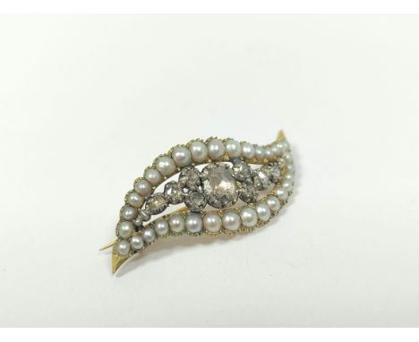 Georgian gold and diamond brooch of waved pointed shape with nine rose diamonds and a border of pearls in gold.Answer to ques