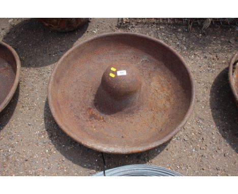A cast iron pig trough 