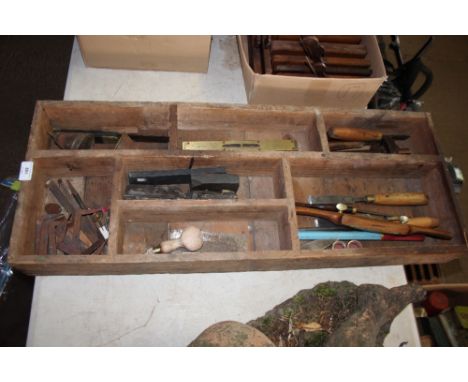 A tray of various hand tools