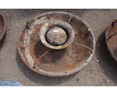 A cast iron pig trough 