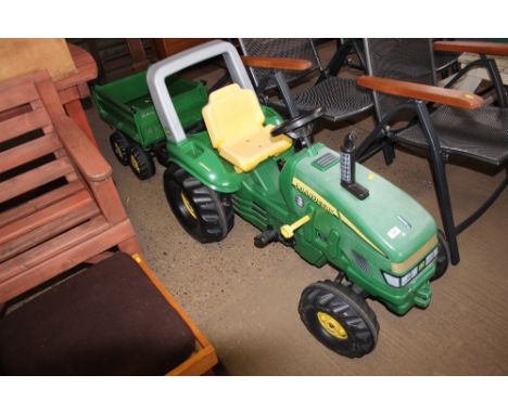 A child's John Deere tractor and trailer