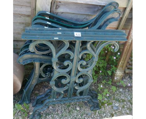 2 sets of cast bench ends together with matching table ends