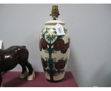 A Moorcroft Pottery Table Lamp, of extended ovoid form, painted in the 'Plum' pattern against an ivory ground, designed by Sa