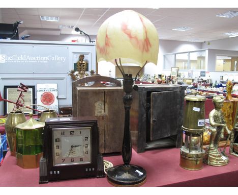 An Art Deco Lamp, with mottled glass shade on a black gilded chinoiserie painted base, plus an Art Deco Bakelite alarm clock,
