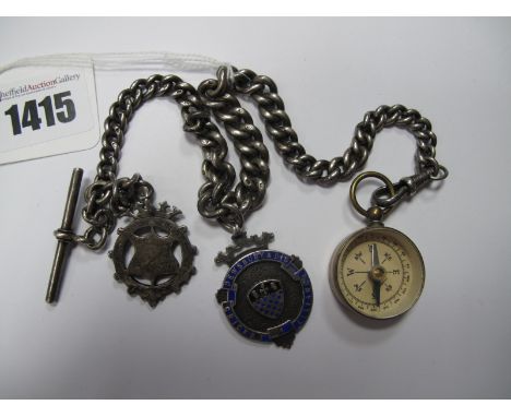A Graduated Curb Link Albert Chain suspending T-bar, "Dewsbury & Dis Cricket Alliance" medallion, "Gilder Hall" pendant and a