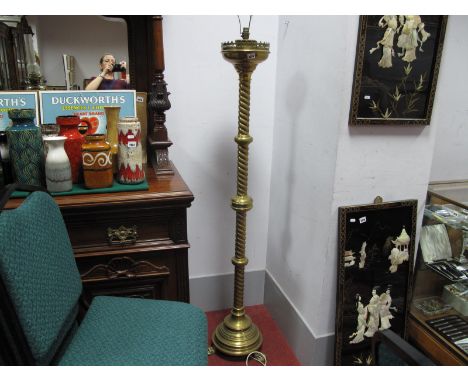 A XIX Century Brass Altar Candlestick, (converted to a standard lamp) with quatrefoil gallery and twisted column, on stepped 