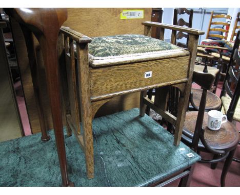 An Early XX Century Oak Piano Stool, with tapestry top to box seat.