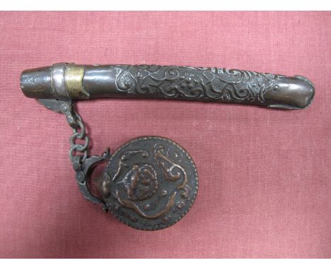 A Late XIX Century Japanese Bronzed Metal Opium Pipe Holder and Circular Box, on attached link chain, embossed with scrollwor