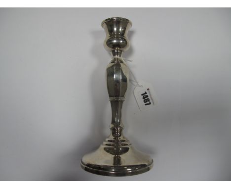 A Hallmarked Silver Candlestick, the shaped stem on plain circular spreading base, 20cm high, Birmingham 1963.