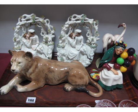 Royal Doulton 'The Old Balloon Seller' HN1315, Melba lion, pair flatback figures, Austrian flamingo group (damaged):- One Tra