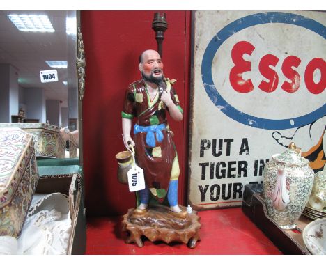 A Ceramic Oriental Gentleman as a Table Lamp, on hardwood base.