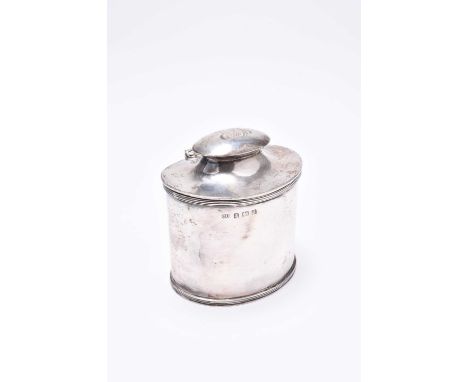 A silver tea caddy, George Unite, Birmingham 1919, of oval form with reeded borders, the hinged cover with engraved initials 