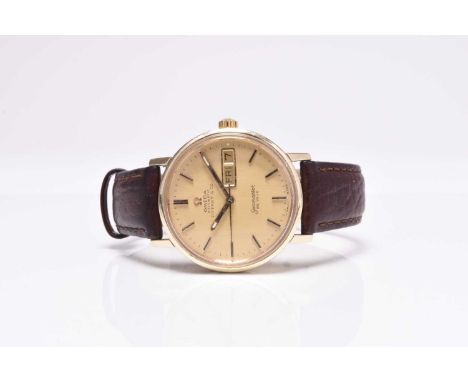 Omega: A gentlemans's gold wristwatch  Model: Seamaster De Ville, retailed by Tiffany & Co Date: Circa 1975 Movement: Jewelle