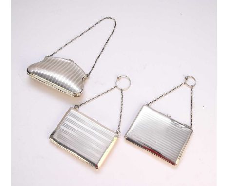 A silver engine turned card case, Henry Matthews, Birmingham, date mark rubbed, with attached chain, 10.5cm wide, together wi