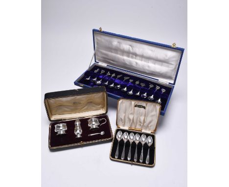 A cased set of six silver teaspoons, Sheffield 1955, together with a cased set of twelve white metal spoons, each with novelt