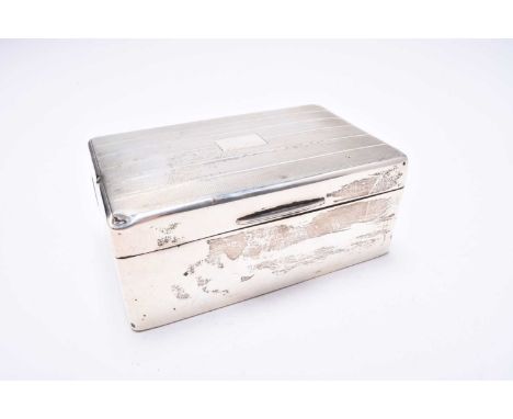 A silver mounted cigarette box, William Neale & Son Ltd, Birmingham, date mark rubbed, of rectangular form with engine turned