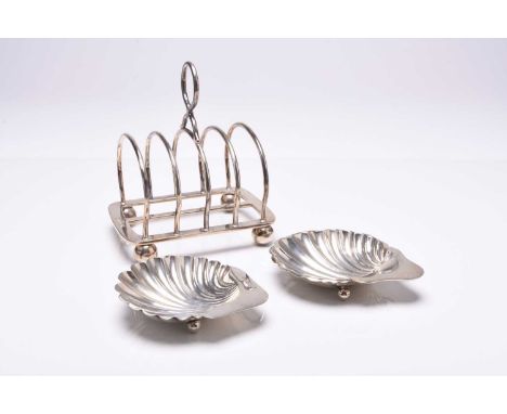 A silver four division toast rack, Elkington &amp; Co, Birmingham 1939, raised on four ball feet, together with two silver sh