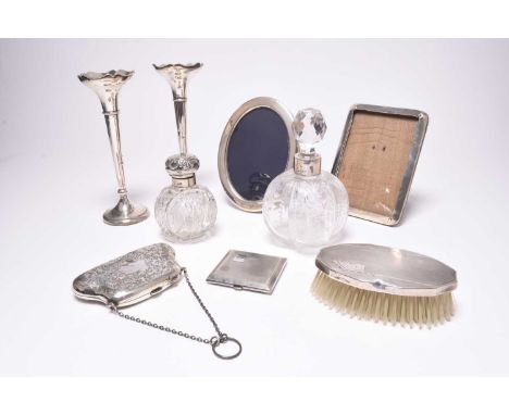 A small collection of silver, comprising; a pair of silver mounted posy vases, Chester 1927, each with later engraved present