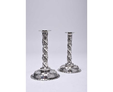 A pair of Victorian silver tapersticks, Samuel Boyce Landeck, import mark for Sheffield 1895, each designed as a wrythen stem