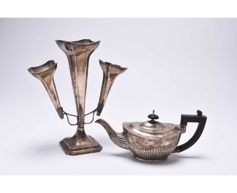 An Edwardian silver bachelors teapot, A &amp; J Zimmerman Ltd, Birmingham 1902, of oval half reeded form with ebonised handle