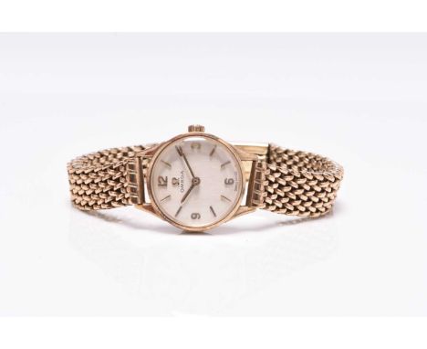 Omega: A lady's 9ct gold bracelet watch Reference: 511.5499 Date: Circa 1965 Movement: 17-jewel cal.620 manual wind Dial: Cha